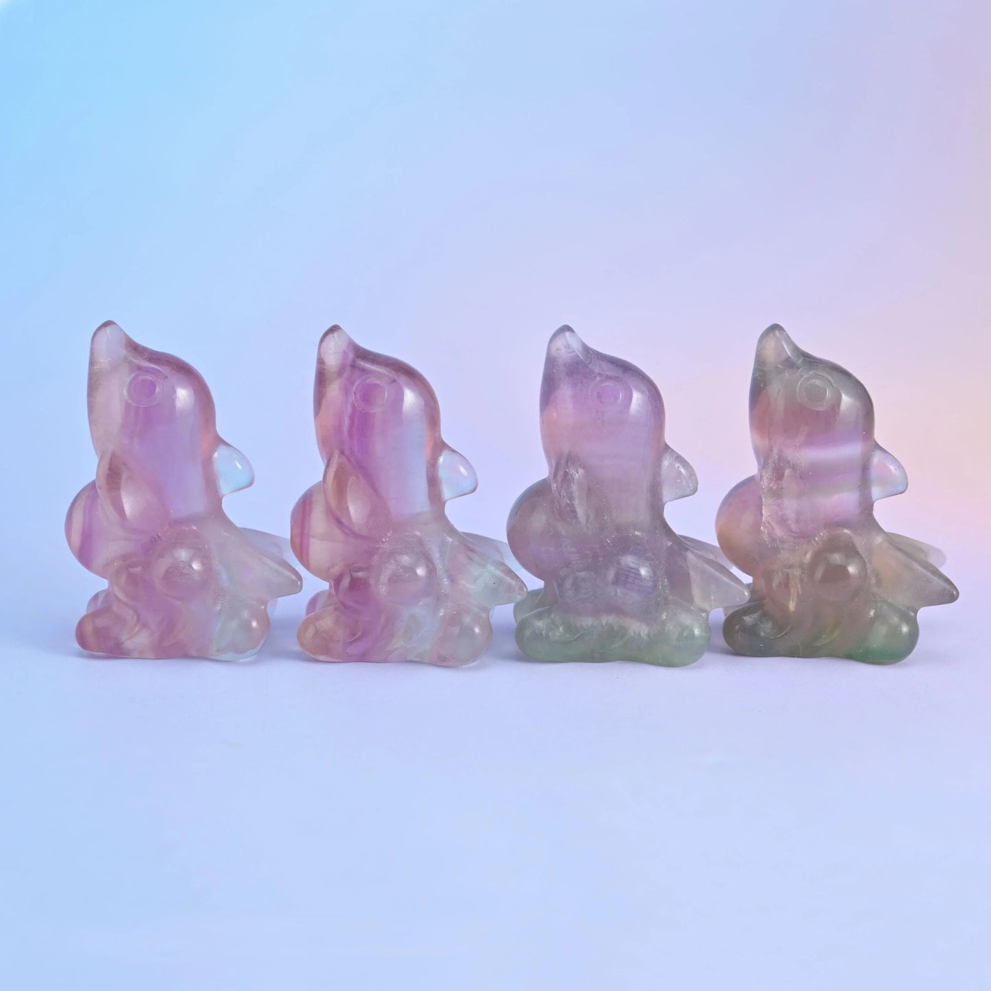 Fluorite dolphin crystal carving, approximately 2 inches long