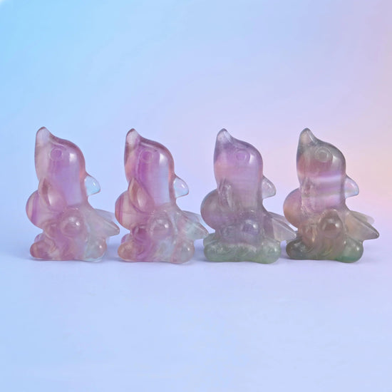 Fluorite dolphin crystal carving, approximately 2 inches long