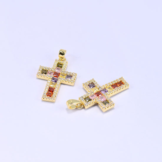 Zirconia cross charms, two gold plated pendants angled to show the depth of the setting