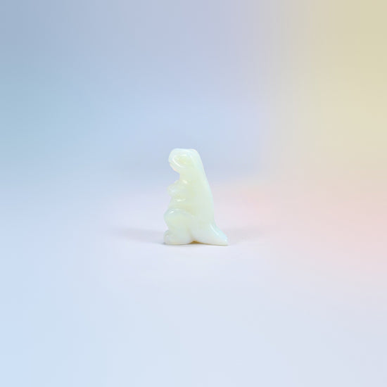 One opalite T-Rex dinosaur crystal carving, 2 inch, glowing milky white man-made glass