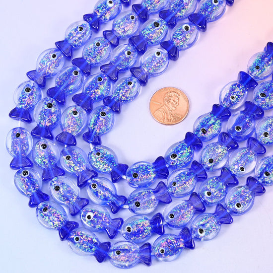 Fish shaped iridescent dark blue glass beads