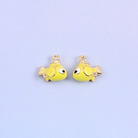 Two fish charms facing each other, showing the big black and white eye on each side.