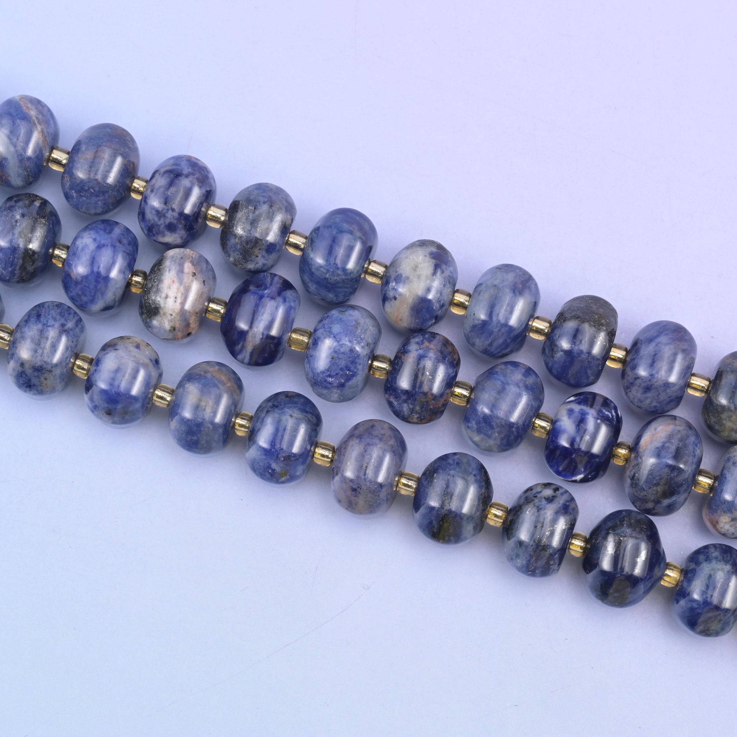 Sodalite beads in deep indigo-blue with white and gray veining