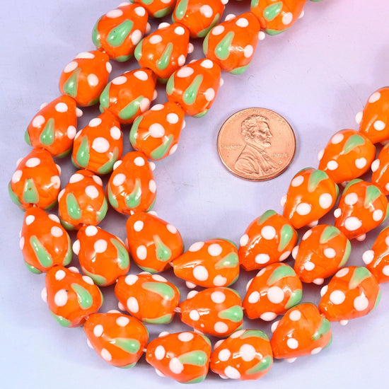 Strawberry shaped lampwork glass beads with white seed dots