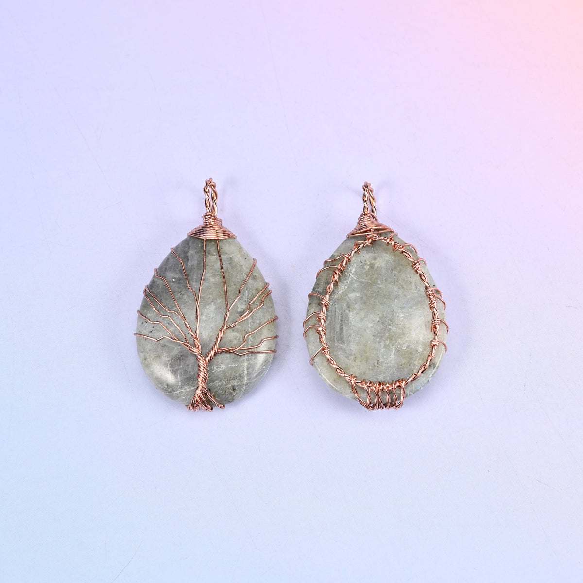 Teardrop Crystal Pendant with Copper Wired Tree in moss agate, front and reverse side by side, the back held by a woven copper wire cage.