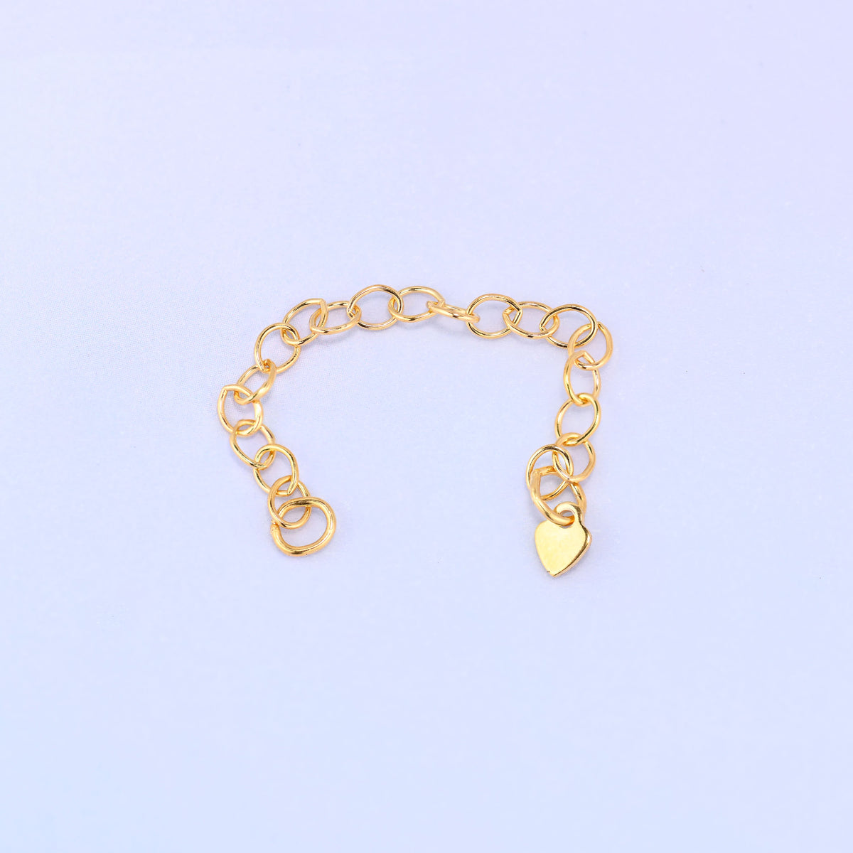 14K gold filled heart chain extender curved into a shallow U shape with the heart charm hanging at one end.