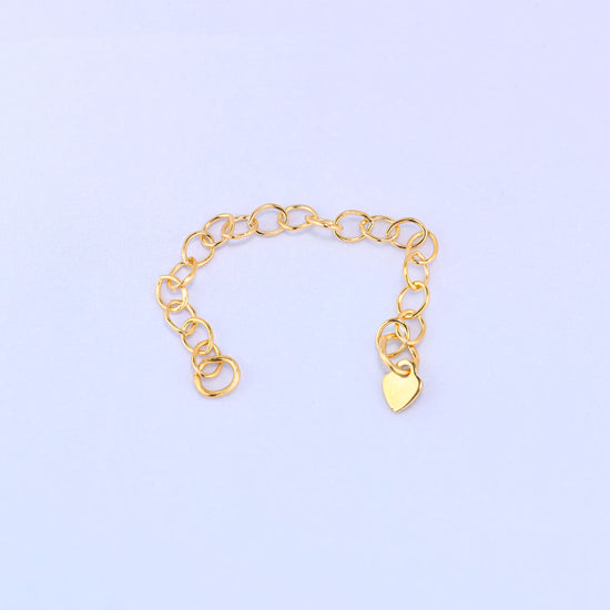 14K gold filled heart chain extender curved into a shallow U shape with the heart charm hanging at one end.