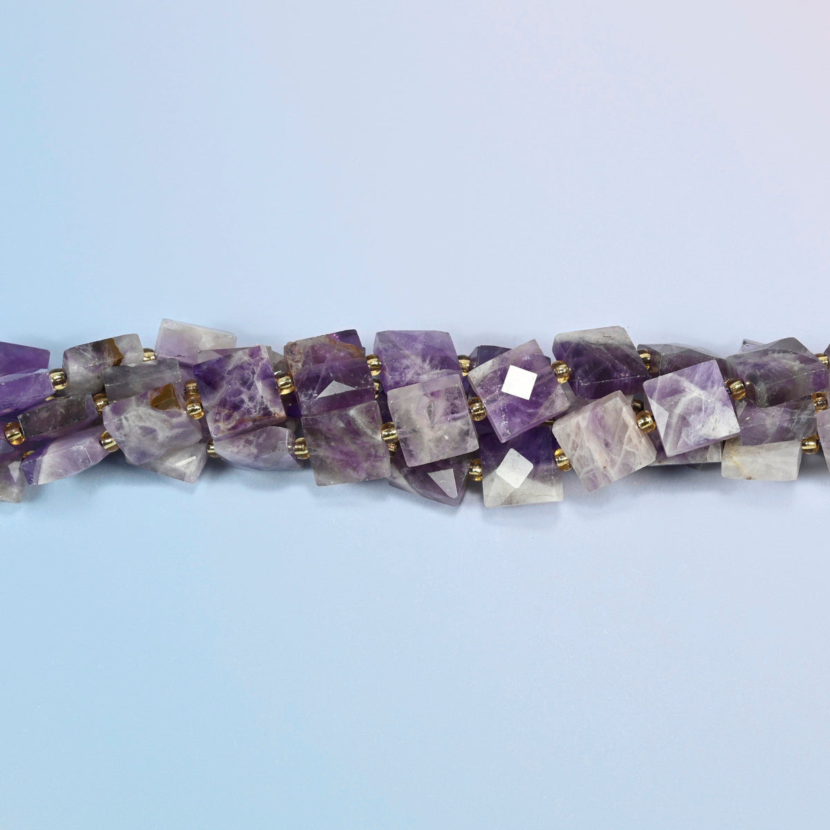 Strands of natural amethyst faceted flat square beads twisted together in a horizontal row