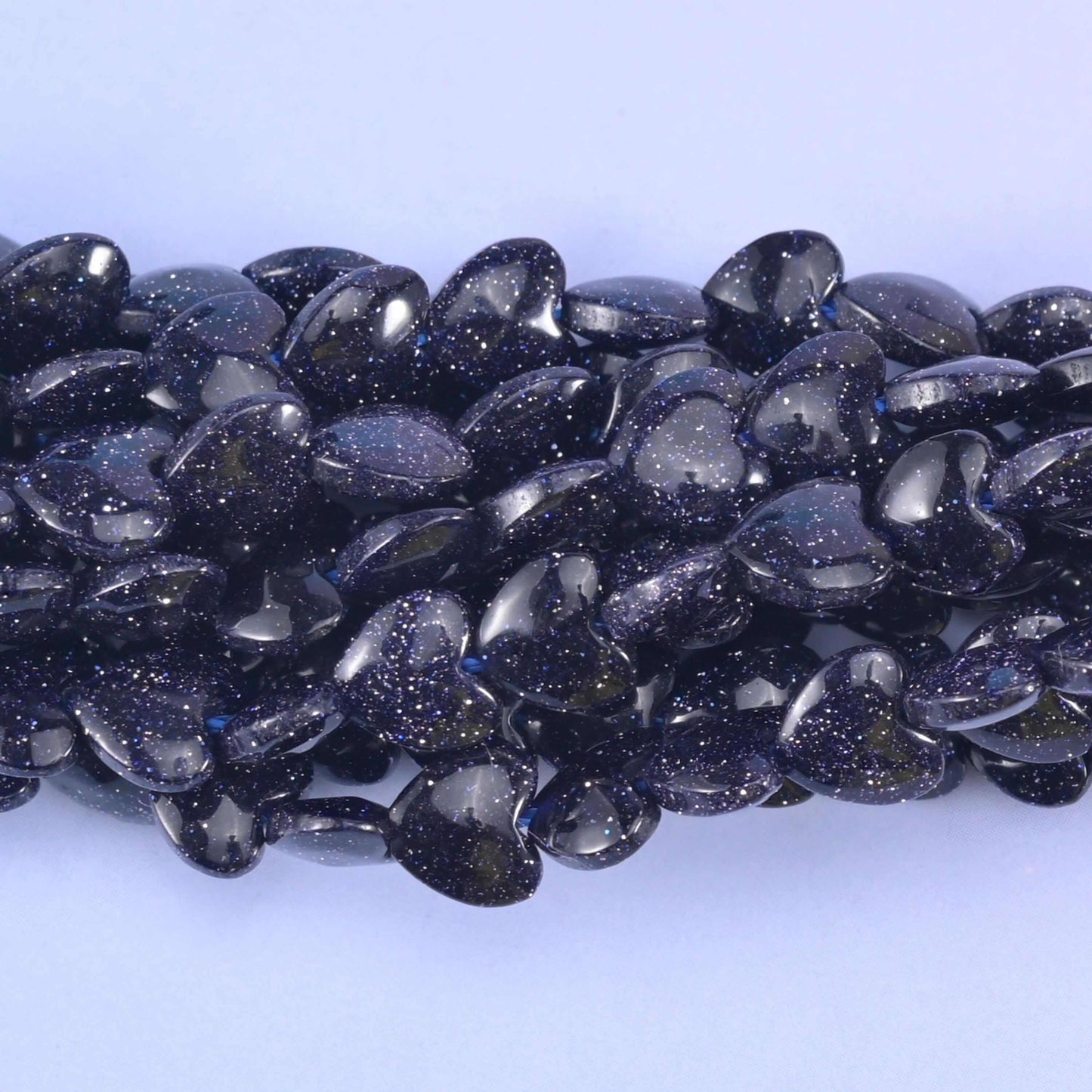 Puffed heart cut blue sandstone beads with a glossy polish