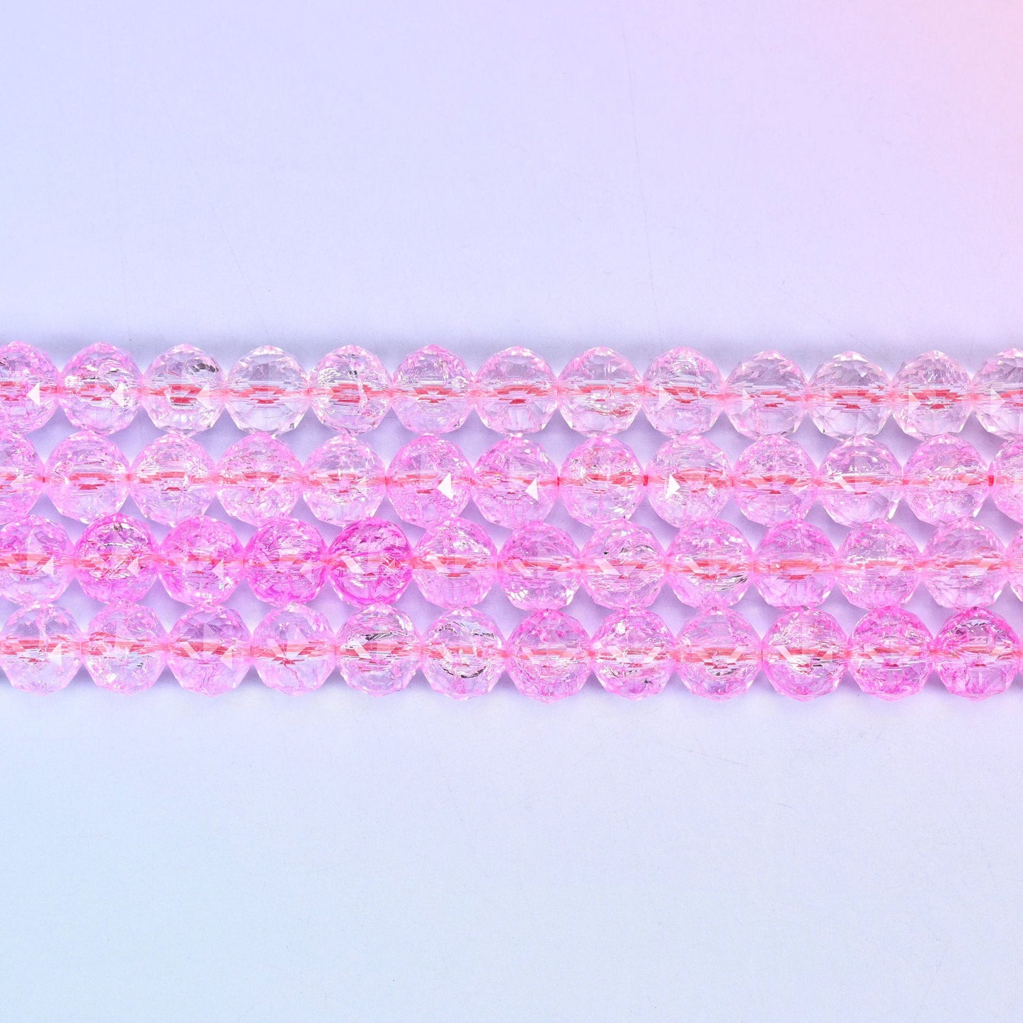 Transparent pink faceted round glass beads in clear bubblegum pink