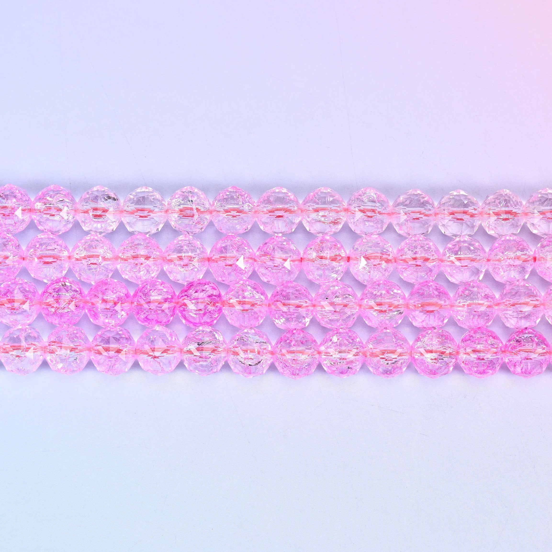 Transparent pink faceted round glass beads in clear bubblegum pink