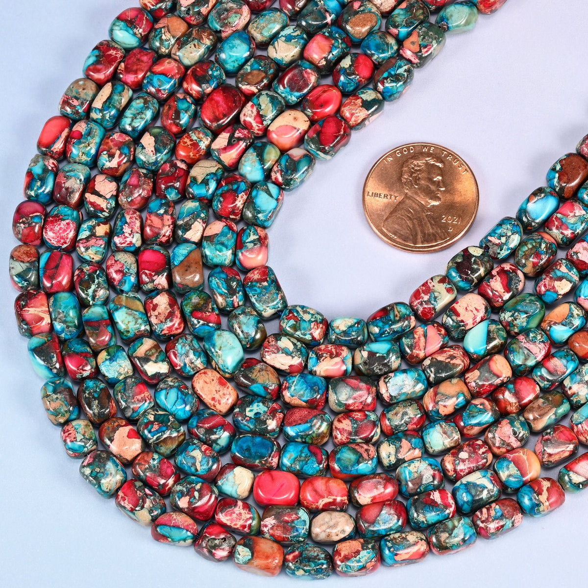 Small rounded nuggets in dyed Sea Sediment Jasper, turquoise blue and brick red