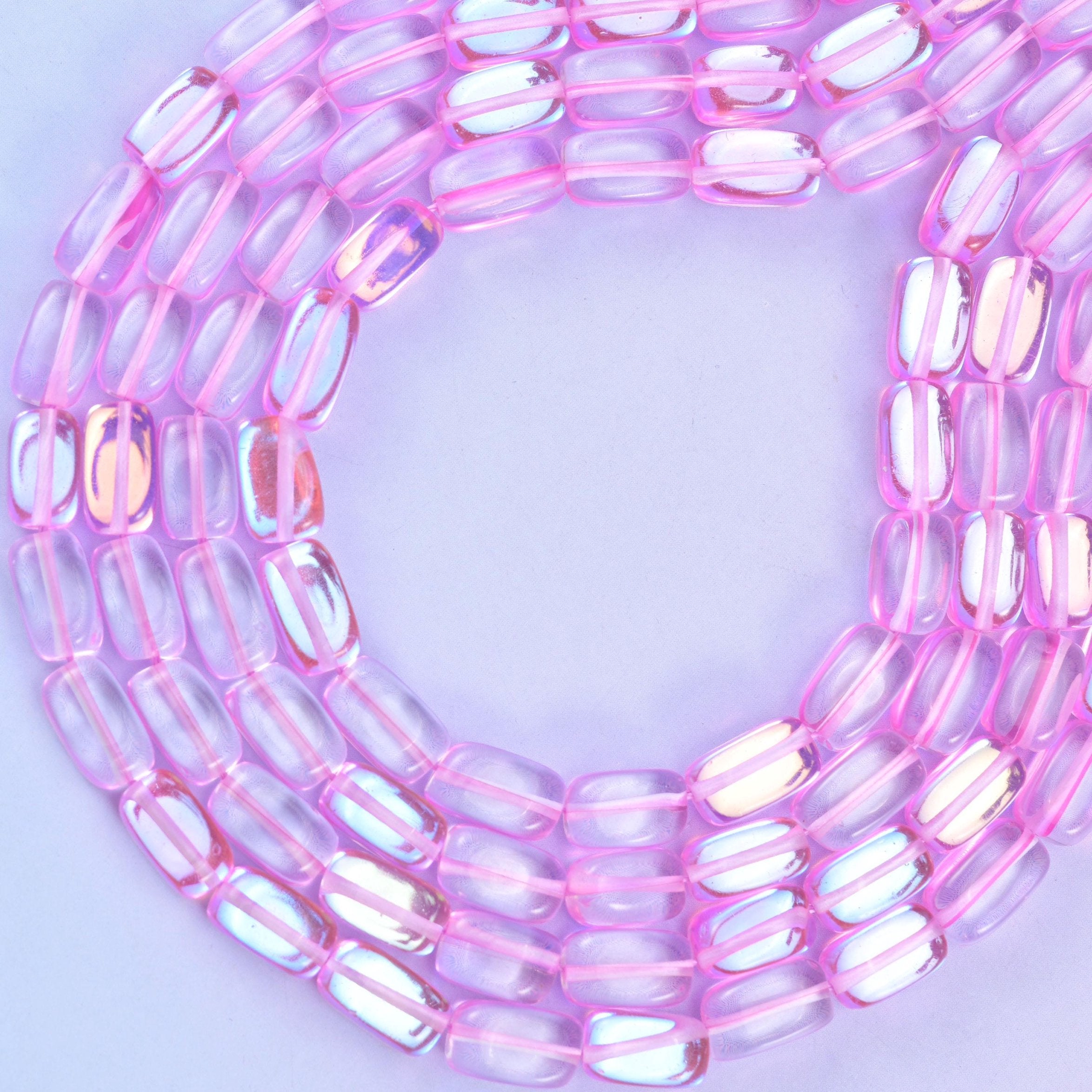 Pink mystic aura glass beads, approximately 34 beads per strand
