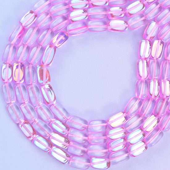 Pink mystic aura glass beads, approximately 34 beads per strand