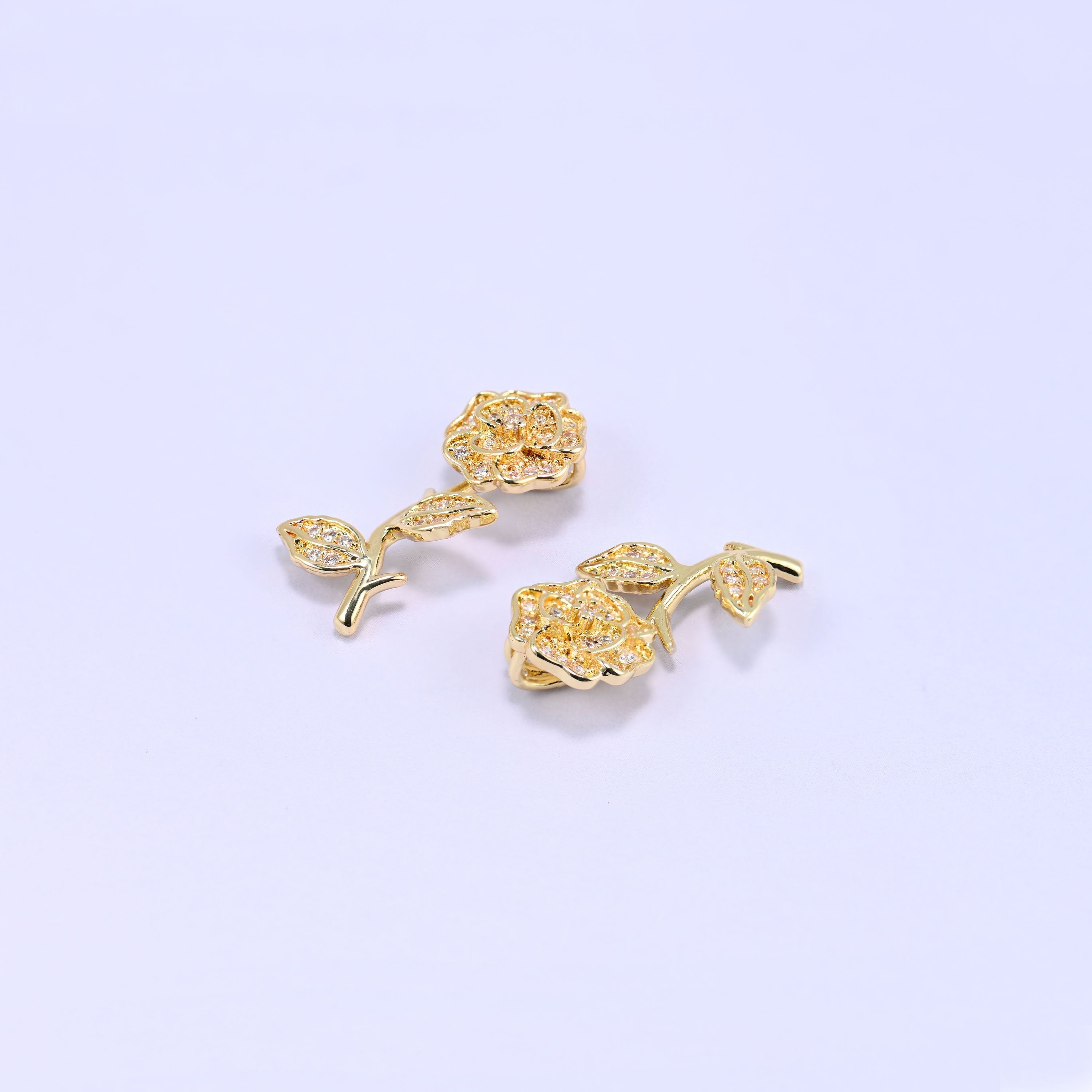 Brass rose and stem charm fully paved in sparkling clear zircon