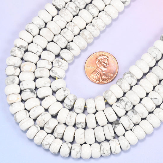 Rondelle cut Natural White Howlite beads with a classic marble-like look.