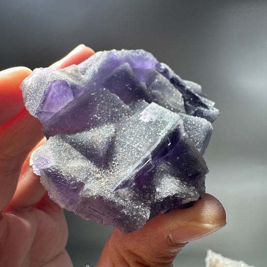 Overhead look at the crystal face, square fluorite faces tiled across the surface
