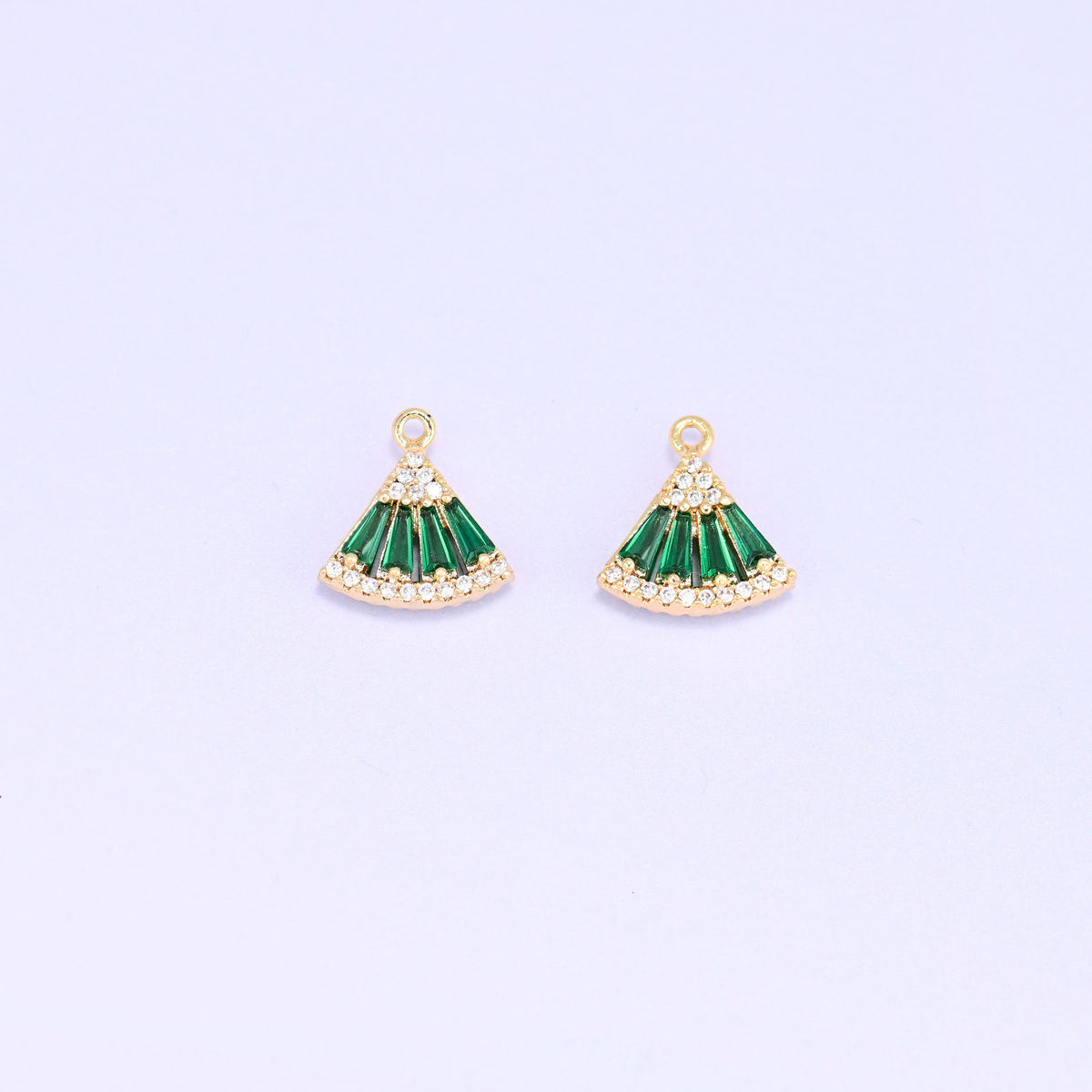 Small gold charms, two green fan charms facing forward