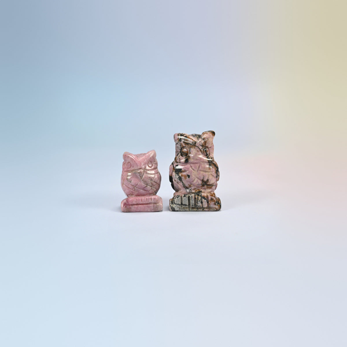 Owl crystal carving in rhodonite, pink natural stone with black veining