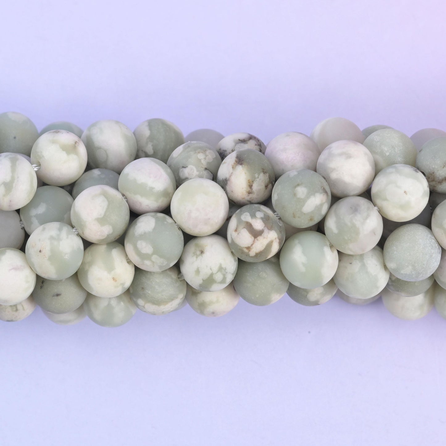 Matte frosted round cut Peace Jasper beads with soft veining