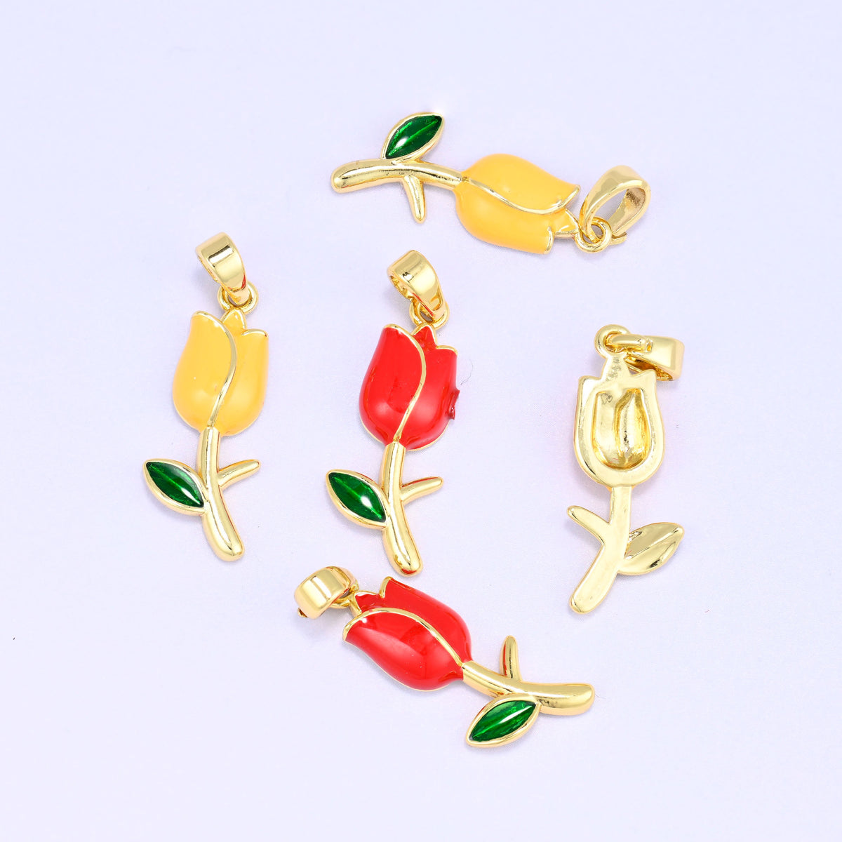 Enamel tulip charms in red and yellow, 18K gold plated, with one turned to show the plain gold-tone reverse