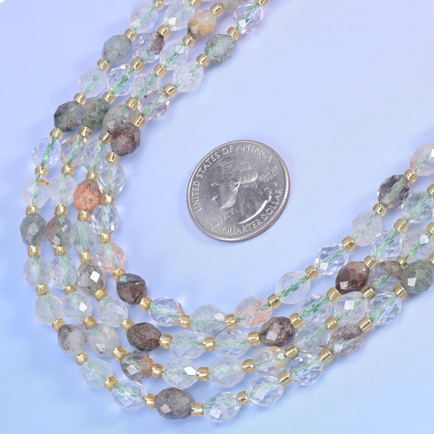 Green Phantom Quartz Faceted Rice Barrel Beads in clear to milky quartz with soft green inclusions