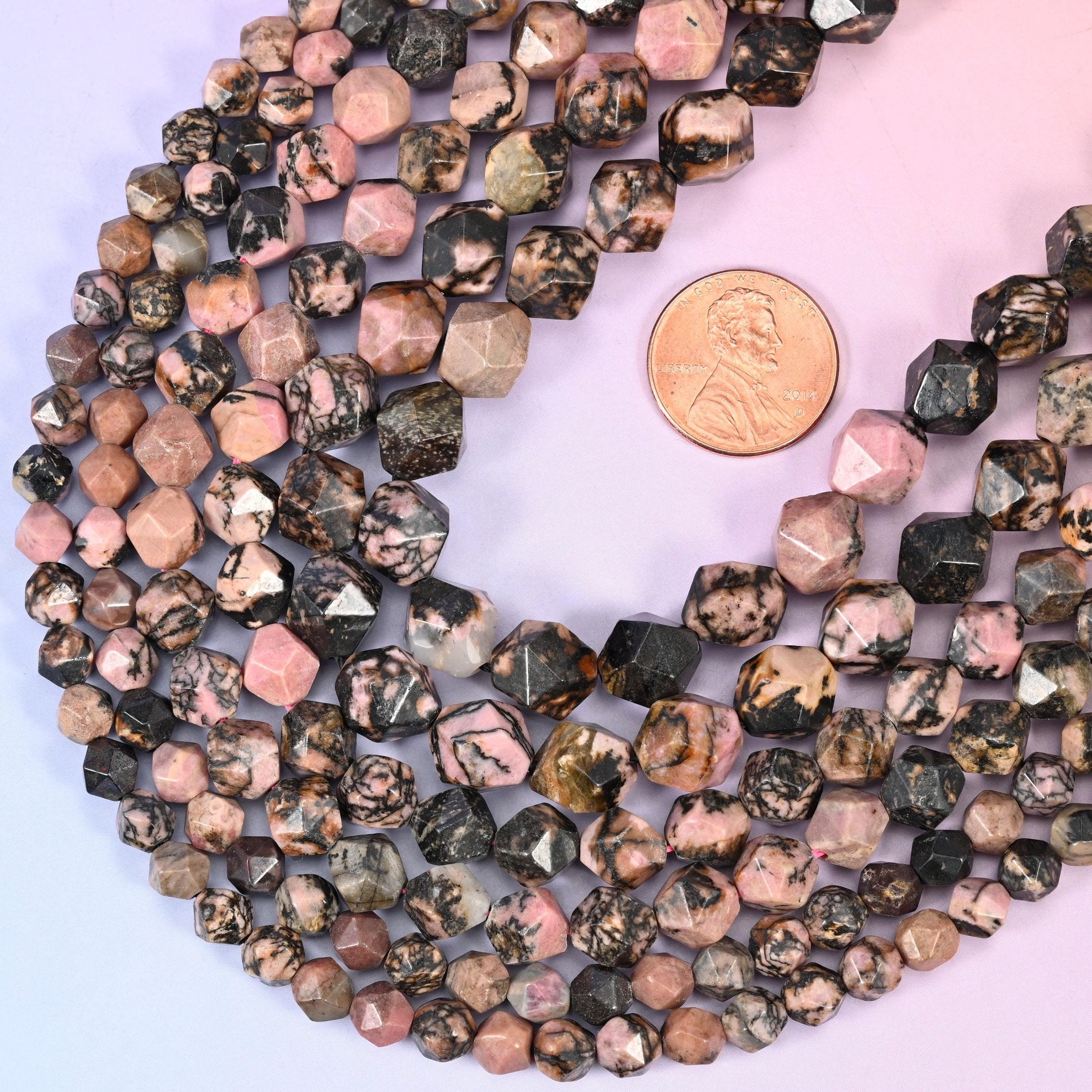 Faceted diamond star cut black line rhodonite beads
