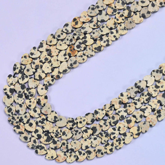 Dalmatian jasper beads in chalky oatmeal cream with charcoal black spots