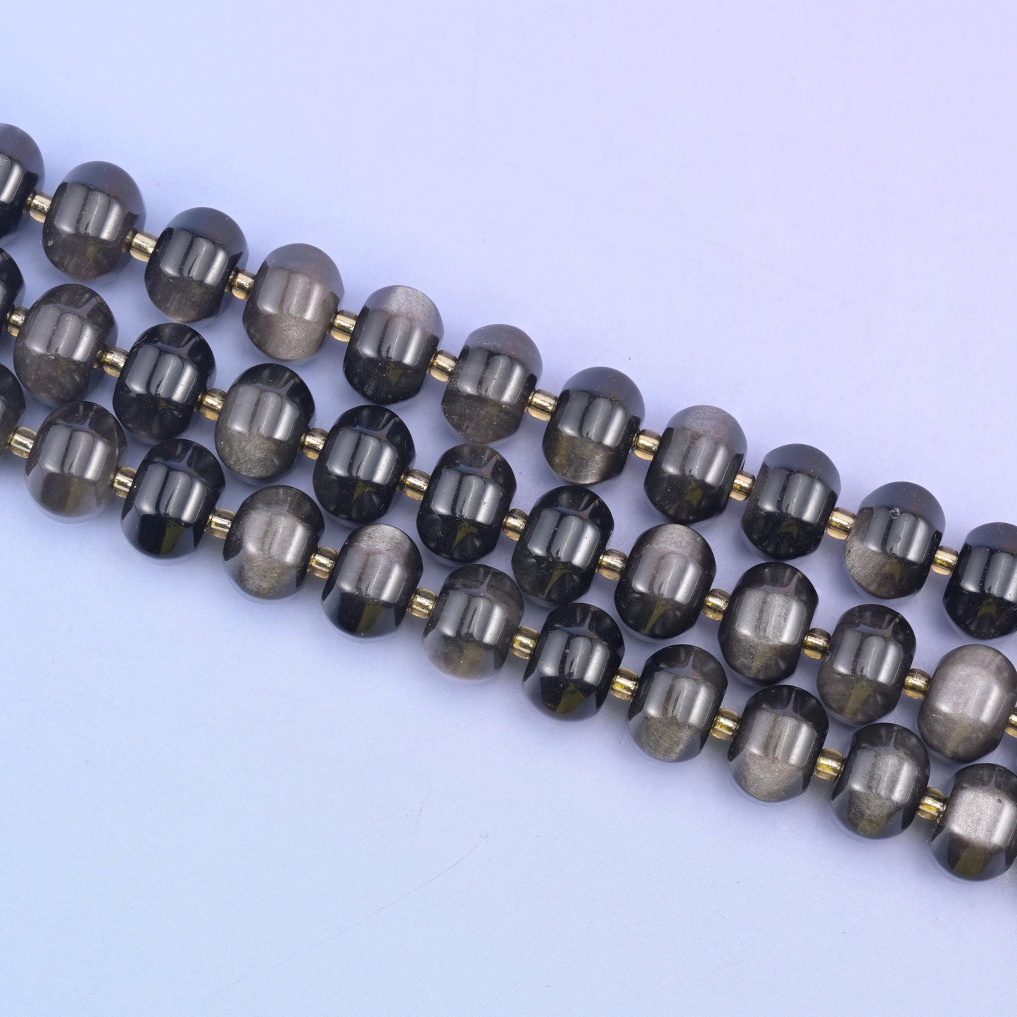 Silver obsidian beads in smoky black with a shimmering silvery sheen