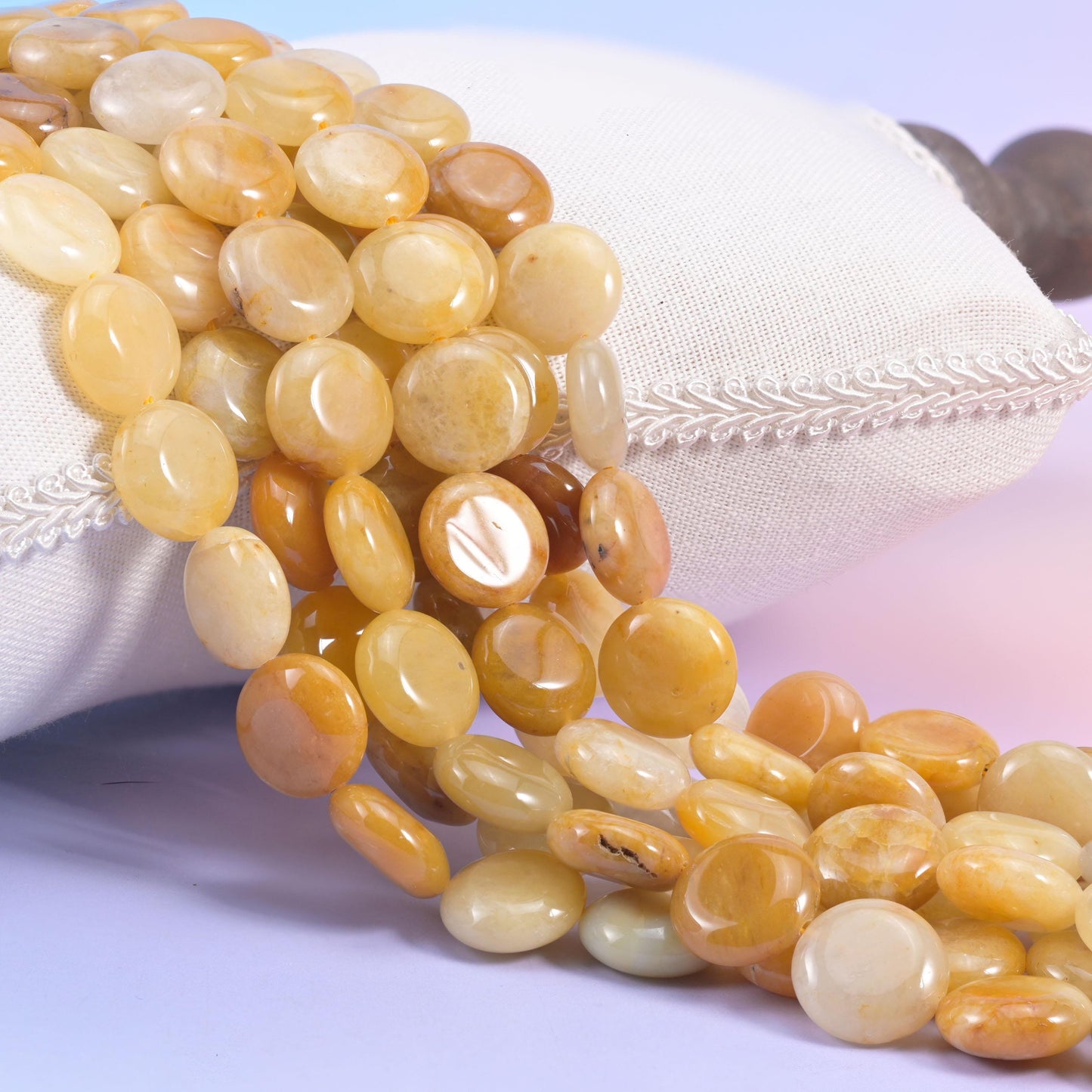 Natural Yellow Jade smooth coin beads in warm honey and butterscotch with cloudy cream centres