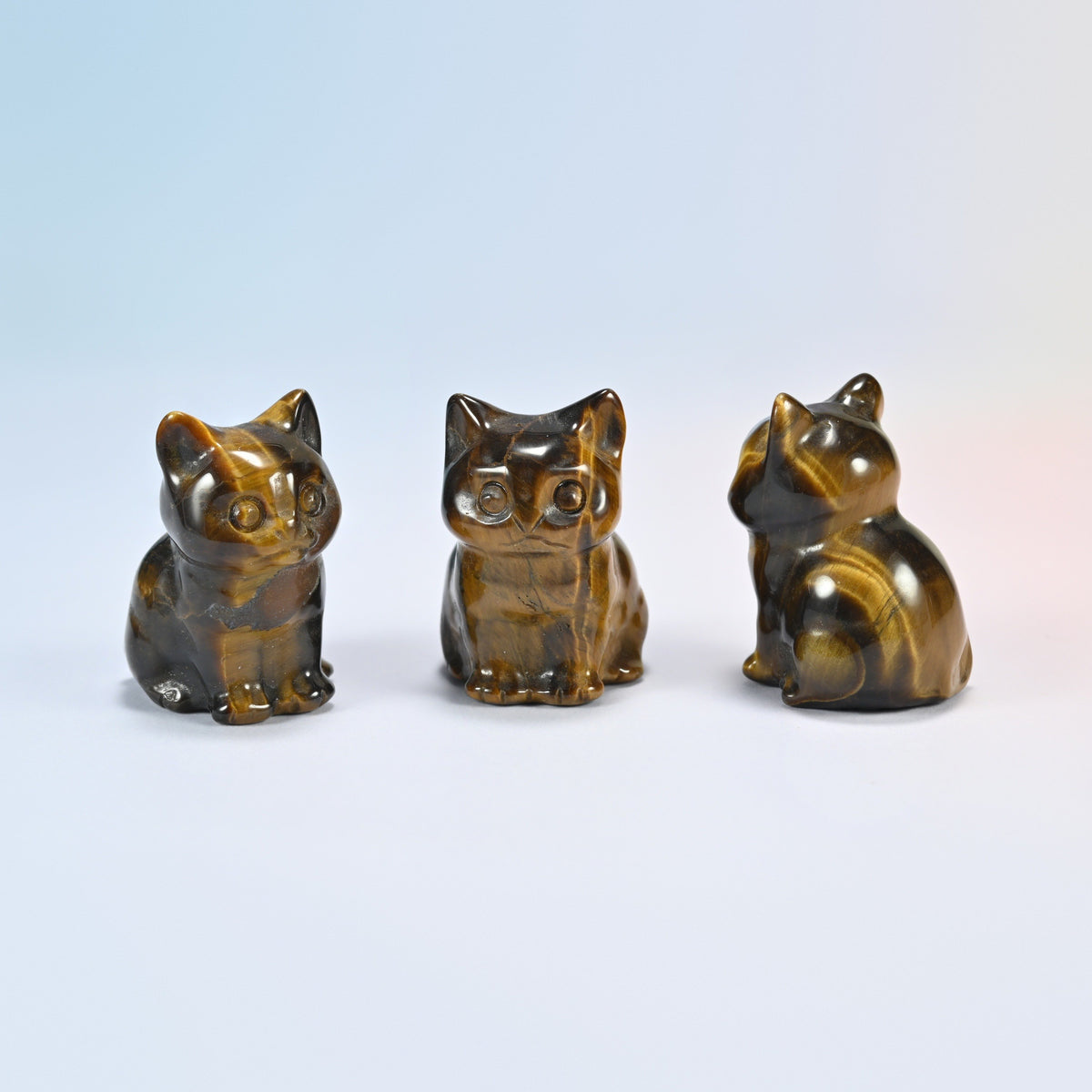 Three natural tiger eye sitting cat crystal carvings, 1.5 inch, golden brown