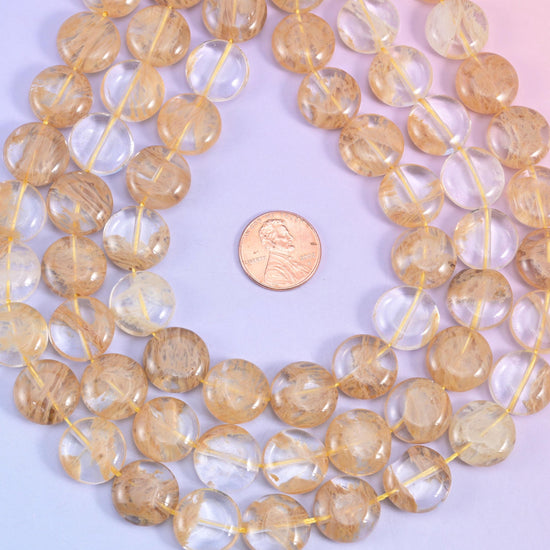 Yellow watermelon quartz coin beads, man-made glass, clear to pale honey discs with golden-brown inclusions