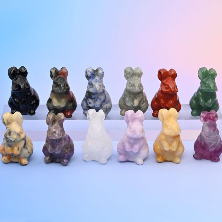 1.5 Inch Rabbit Crystal Carving Figurine, a seated rabbit with ears laid back along its spine.