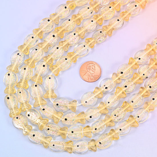 Fish shaped iridescent glass beads