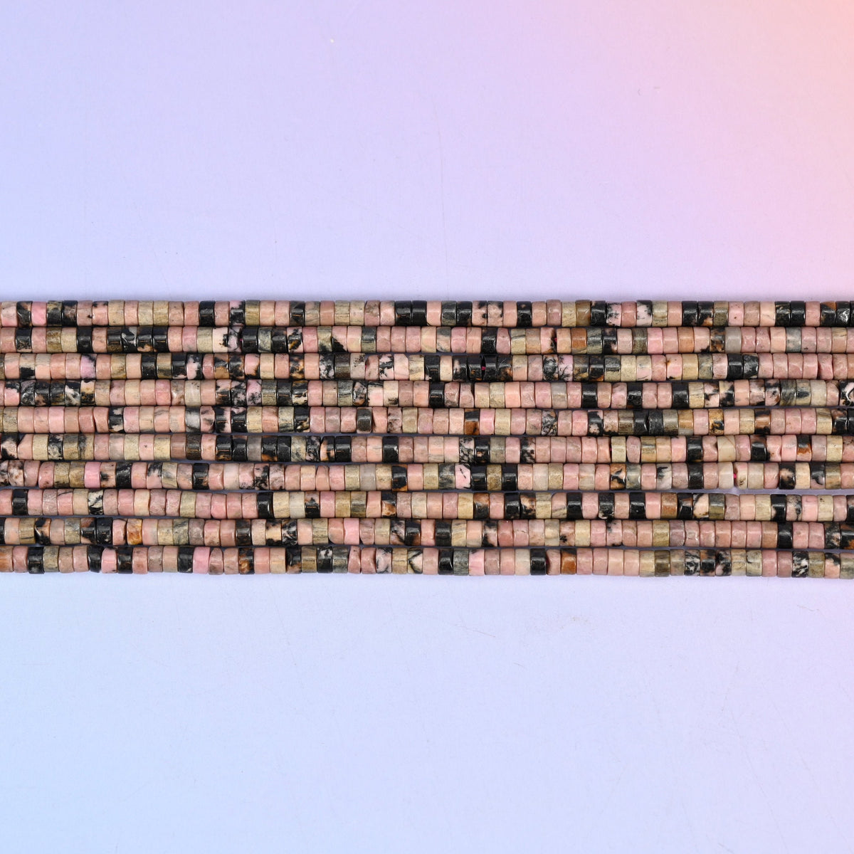 Rhodonite Smooth Heishi Disc Beads in warm pink with dark veining