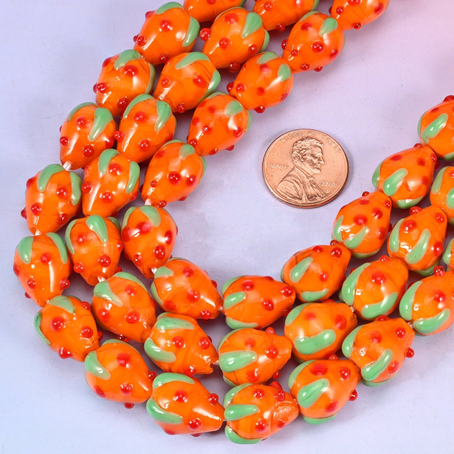 Lampwork strawberry shaped orange glass beads