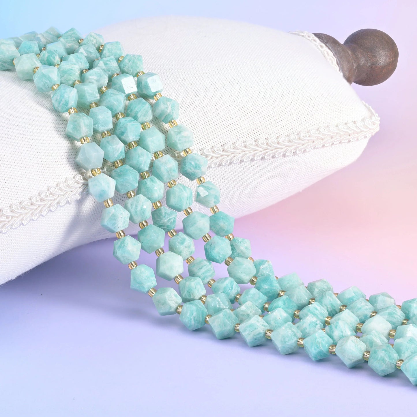 Faceted rhombus beads, centre-drilled, hole approximately 1.0mm with a +/- 0.2mm difference.