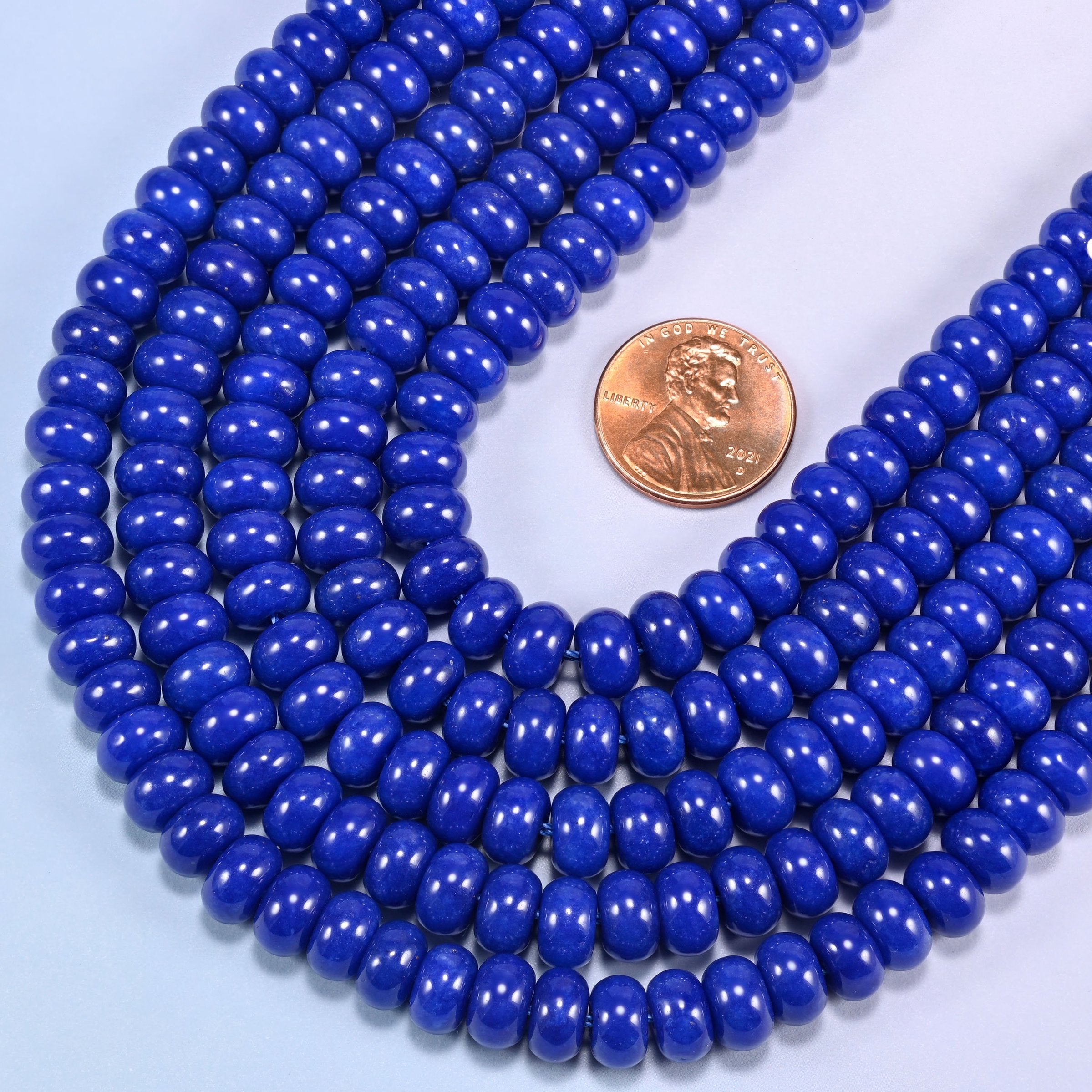 Dark Blue dyed jade gemstone rondelle beads in a wide U, each bead 5x8mm with a 1.0mm centre-drilled hole