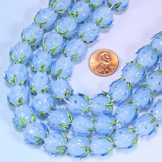 Tulip flower bud with leaf detail at the base cut lampwork glass beads