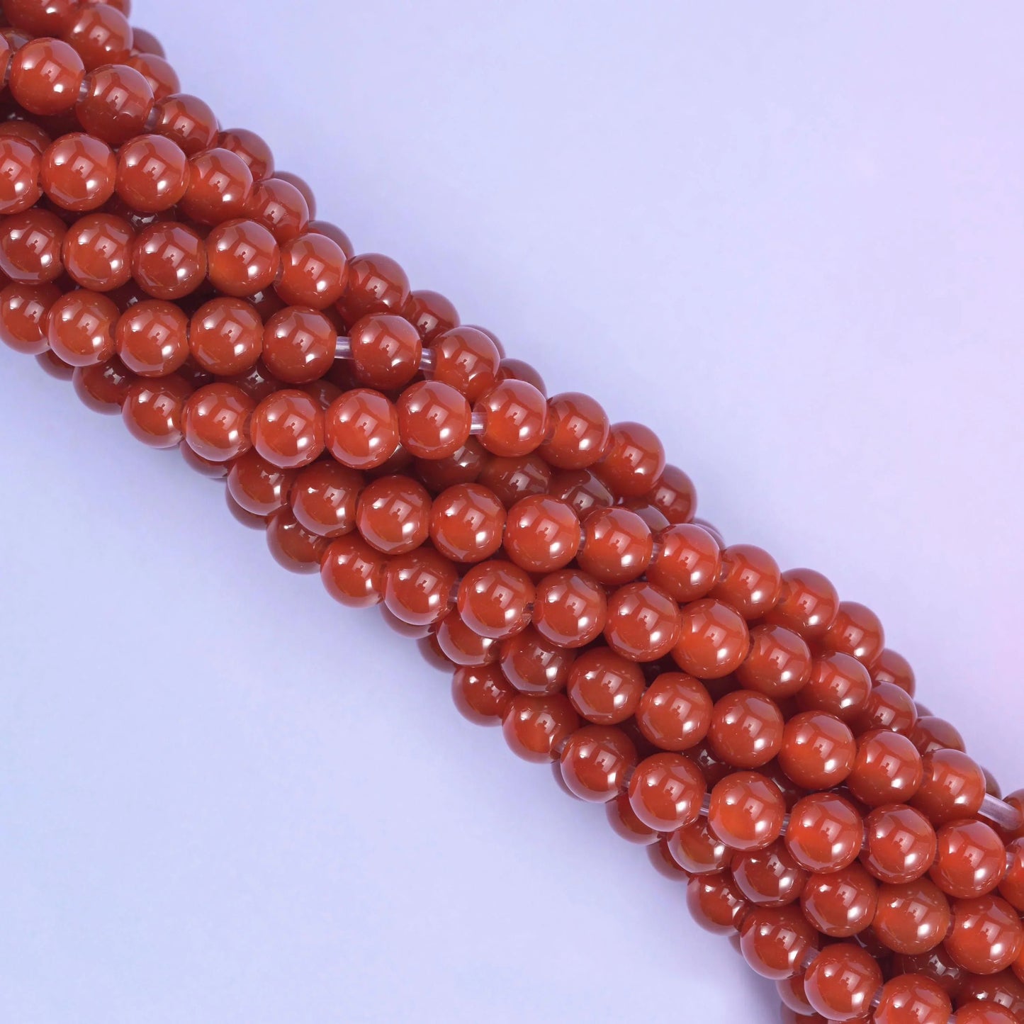 Smooth round cut red agate beads
