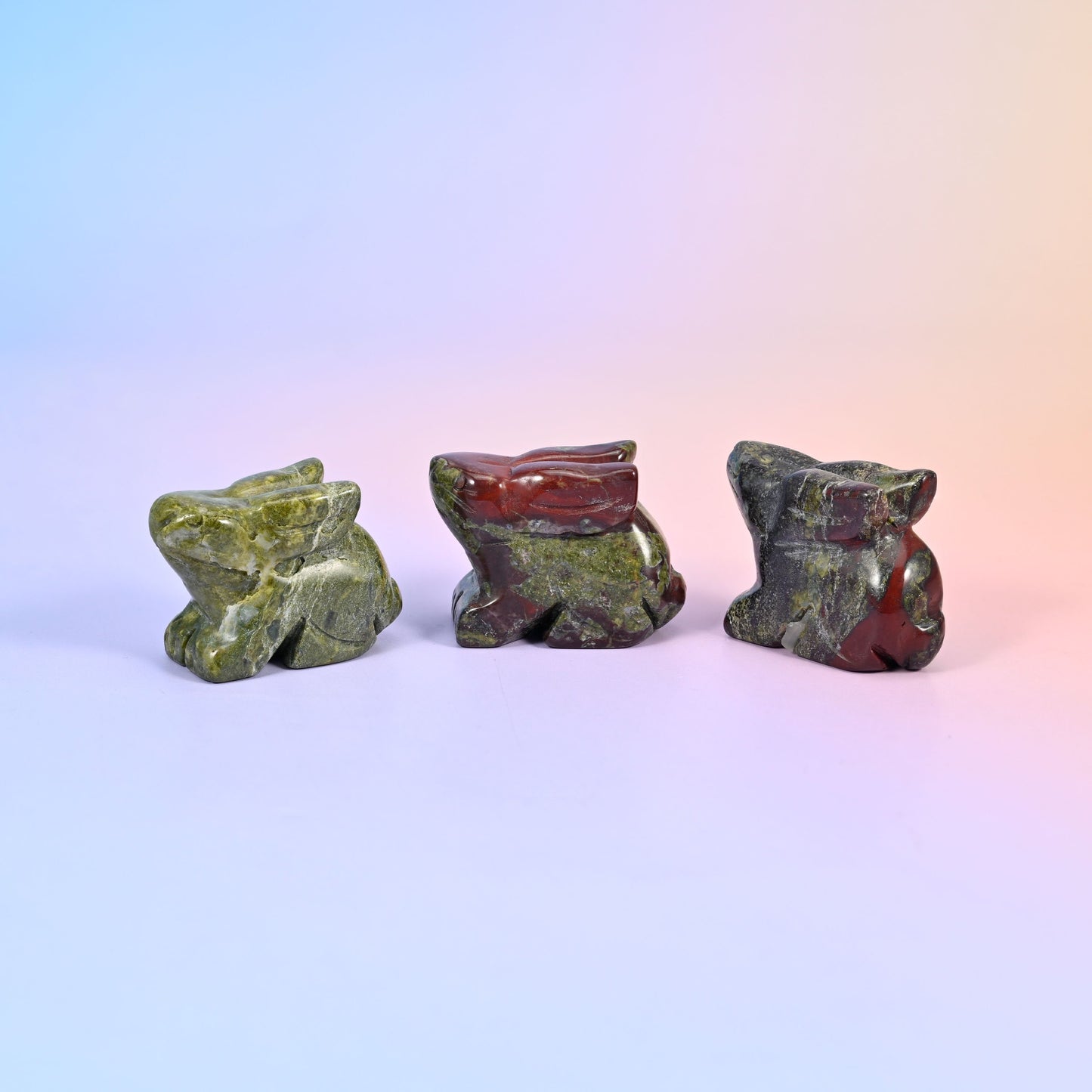 1.5 inch laying down bunny crystal figurine, carved with folded ears, tucked paws and a rounded tail