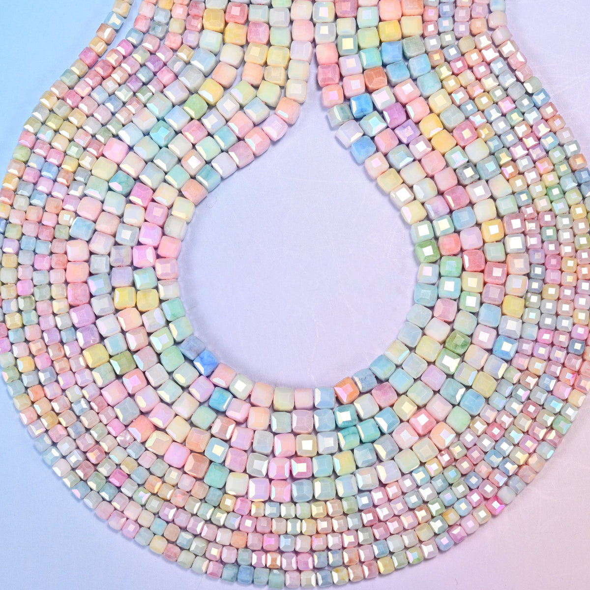 Faceted cube cut glass beads for spacers between larger stones.