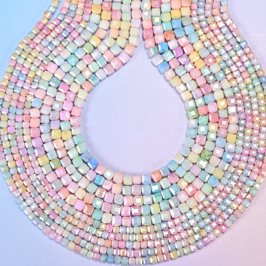 Faceted cube cut glass beads for spacers between larger stones.