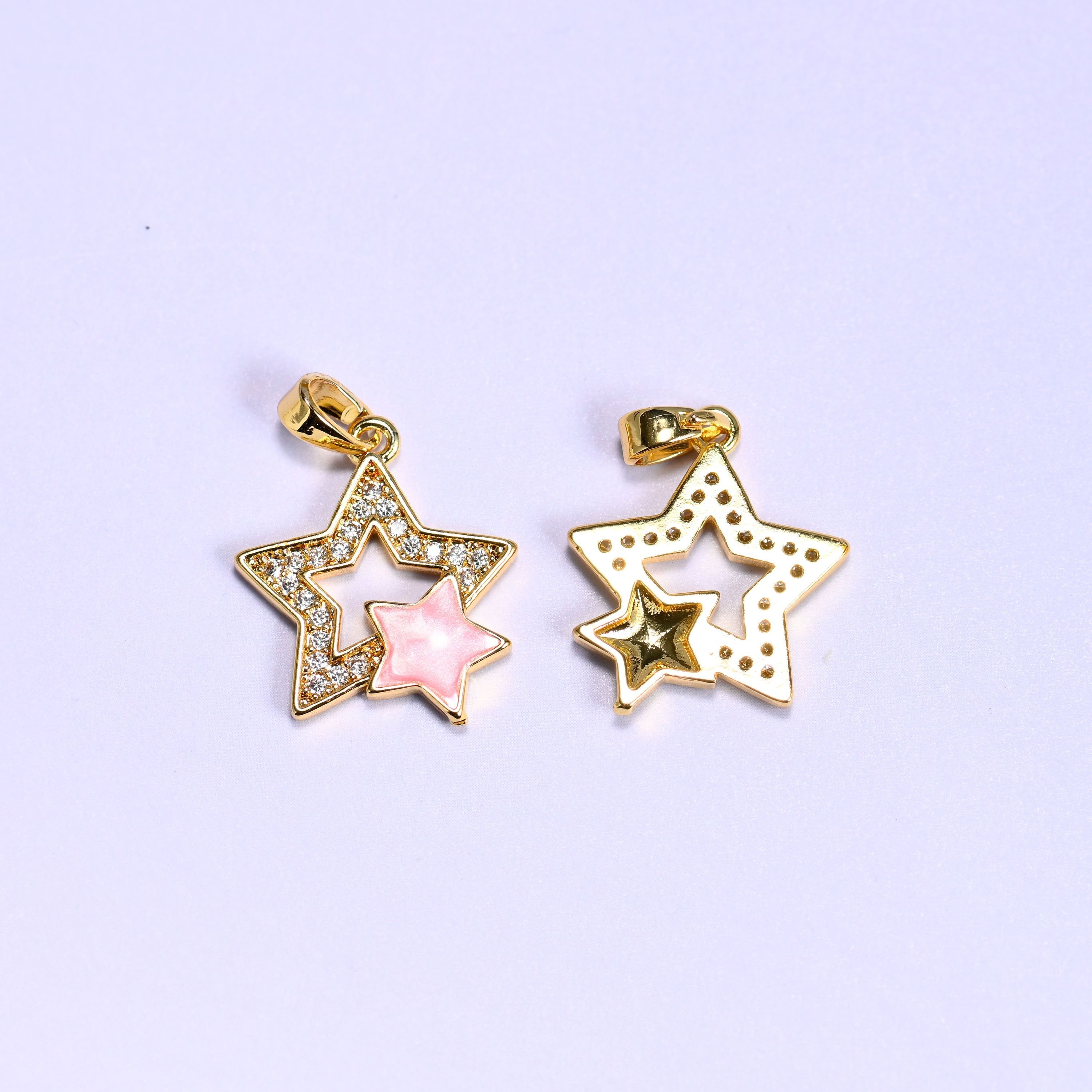 Double star charm with a shell inner star and zircon pave outer star