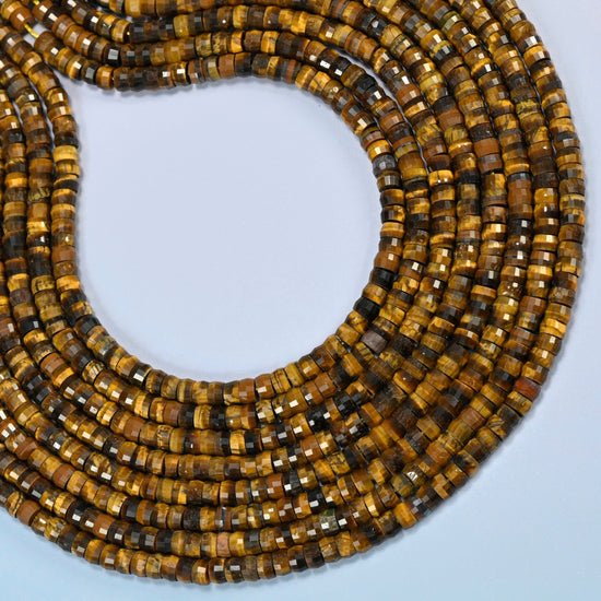 Tiger eye faceted heishi disc beads curved into an open loop, golden brown and dark brown beads