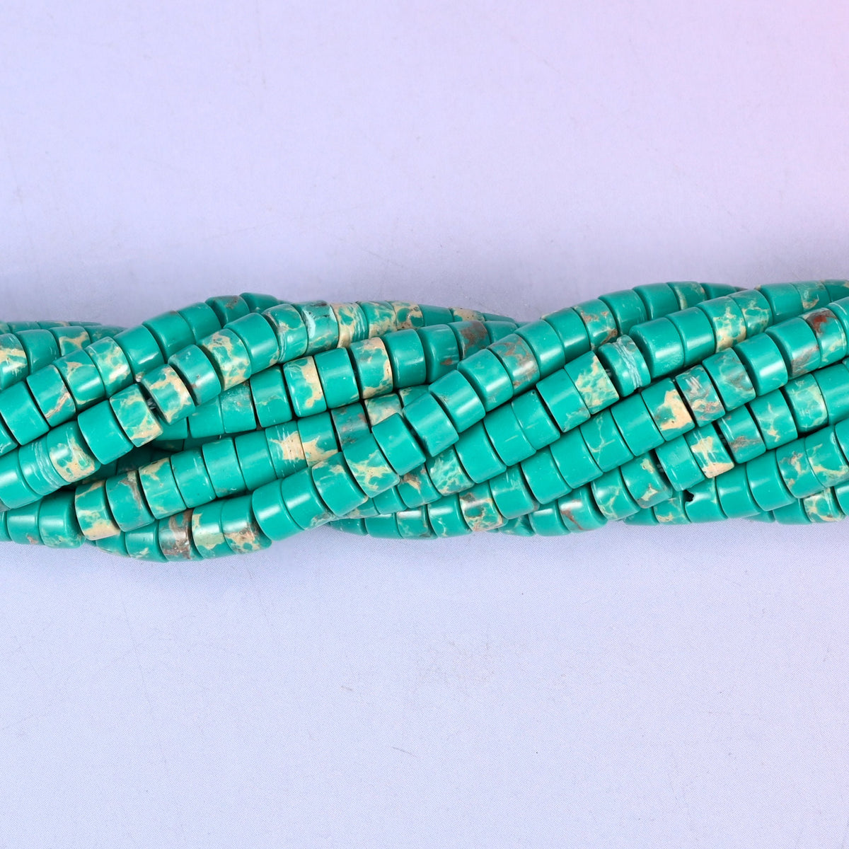 Green Shoushan Stone smooth heishi disc beads (dyed) in turquoise-green with cream and rust mottling, finished with a polished, sophisticated look.
