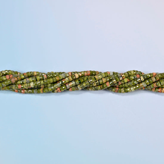 Strands of unakite faceted heishi disc beads twisted together in a horizontal row
