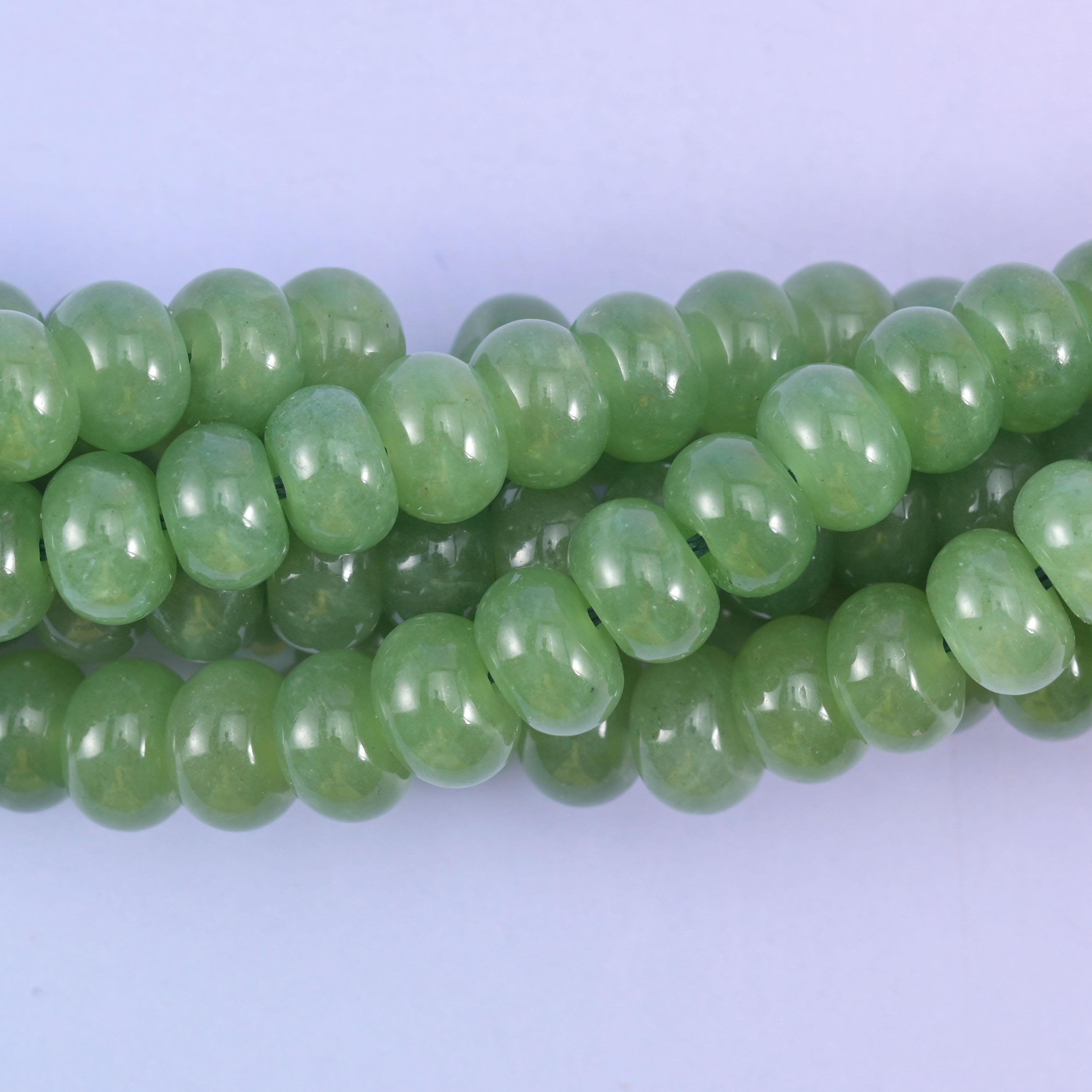Smooth rondelle cut dyed jade beads with a polished surface