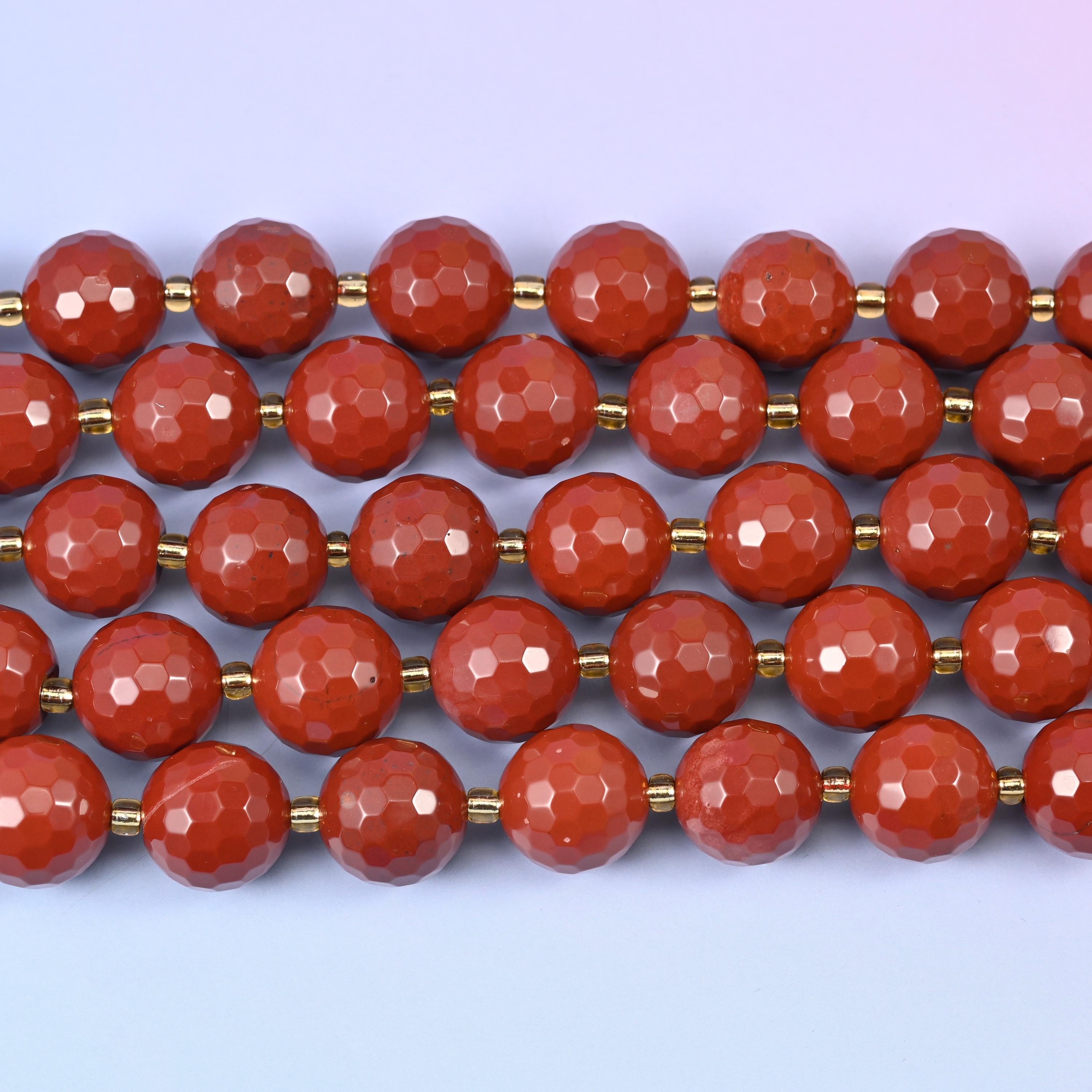 Red Jasper in matte-soft terracotta with tiny bright facet highlights