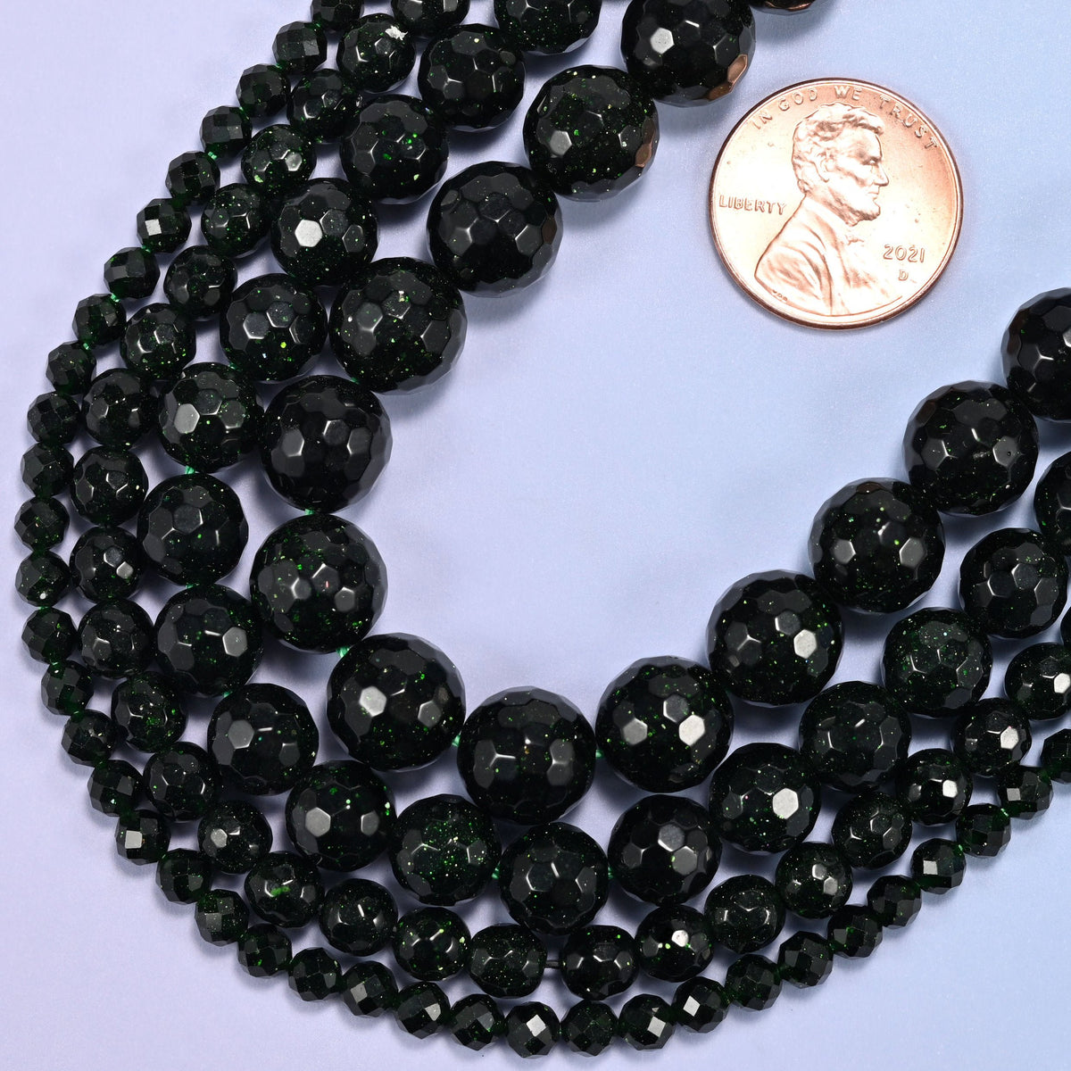 Faceted round cut green sandstone glass beads